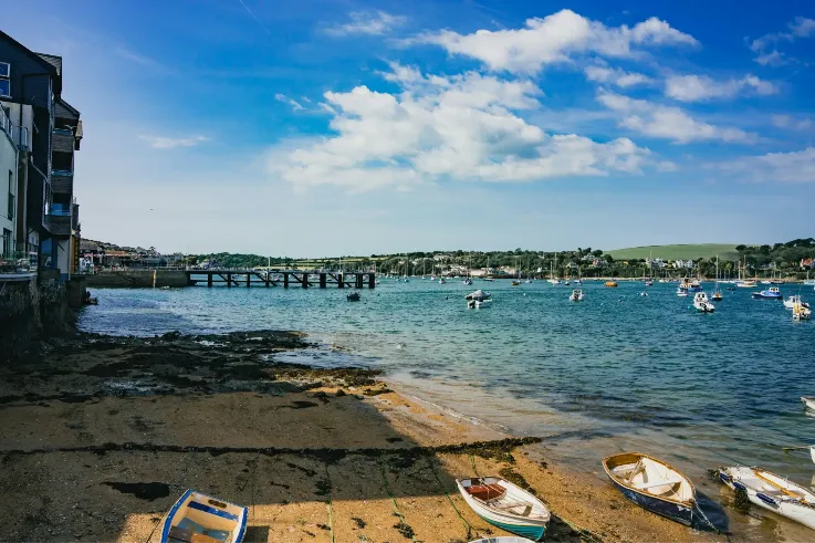 Boats on a sandy harbour beach in Cornwall