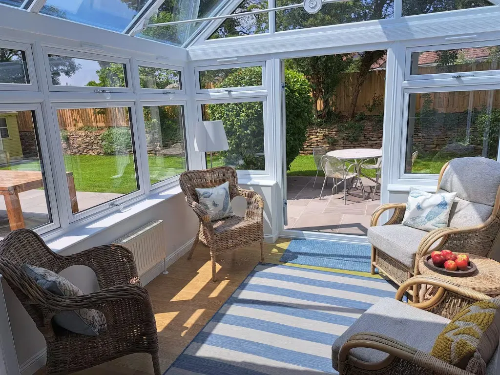 Conservatory looking onto the garden at Trevallion, Trelights