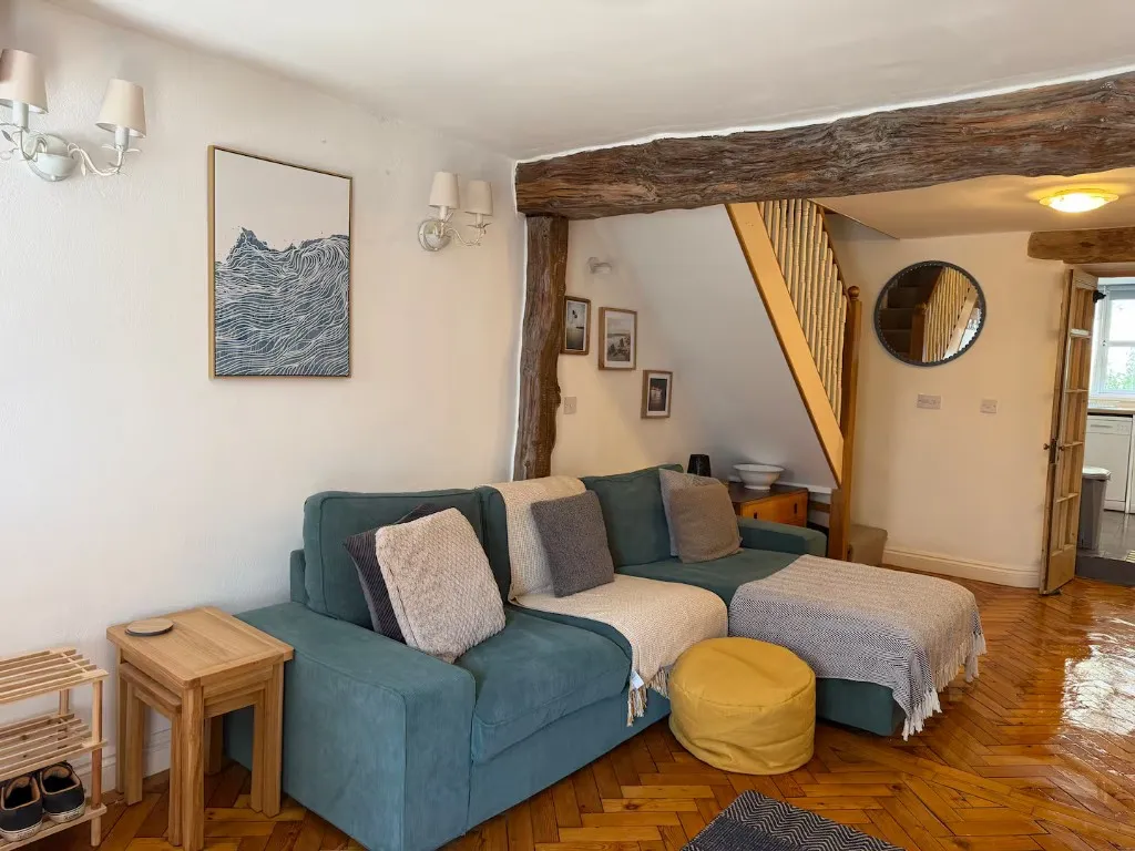 Living room with exposed beams at The Blue House, Wadebridge